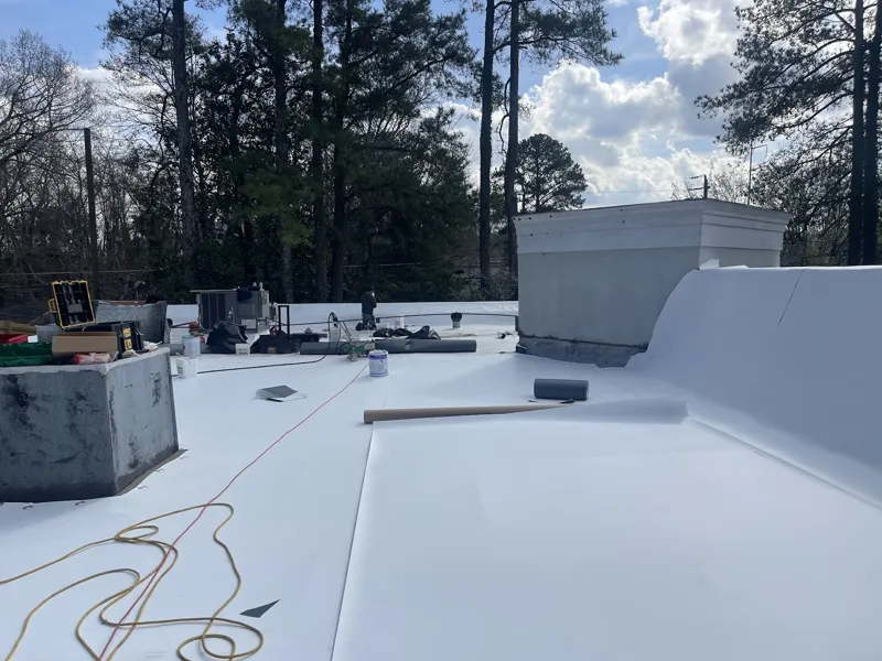 TPO installation with parapet and curb flashing