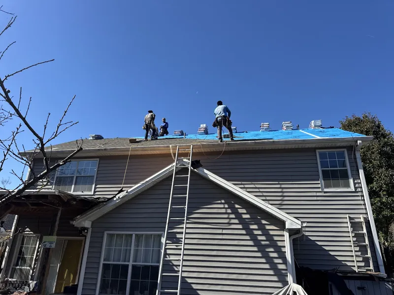 MDJ crew replacing a storm-damaged roof